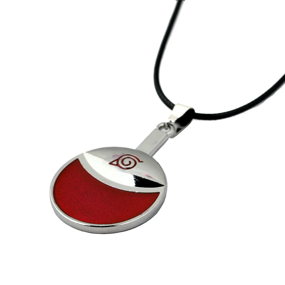Close-up of Uchiha Clan pendant on metal necklace, Naruto merchandise in Pakistan