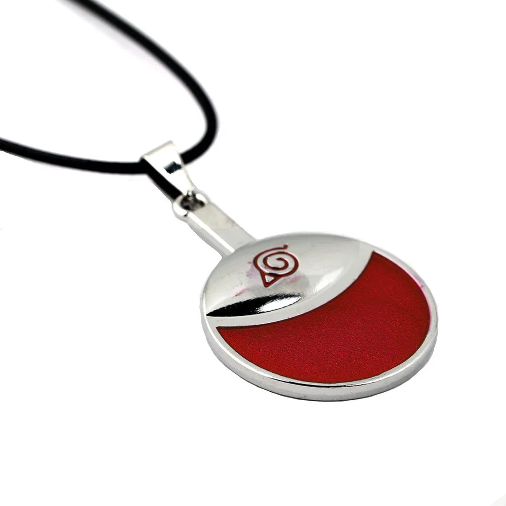 Close-up of Uchiha Clan pendant on metal necklace, Naruto merchandise in Pakistan